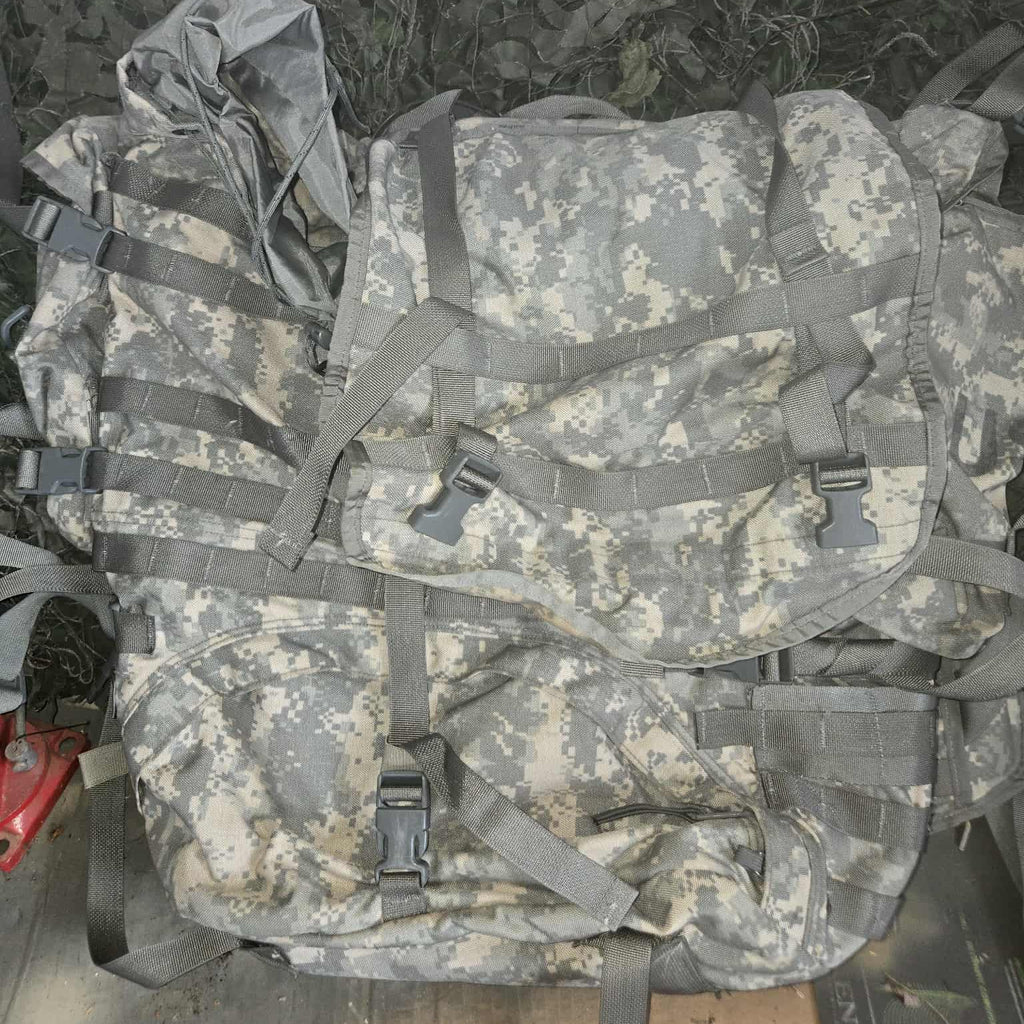 Camouflage backpack with ACU pattern on a wooden surface